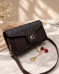 Coach Shoulder Bag with Cherry Keychain.